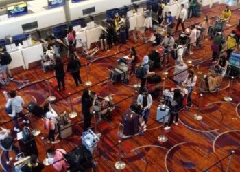 Filipino repatriates checking in for the Scoot TR 1390 flight for Manila last 27 July. Photo - Raul Macapinlac