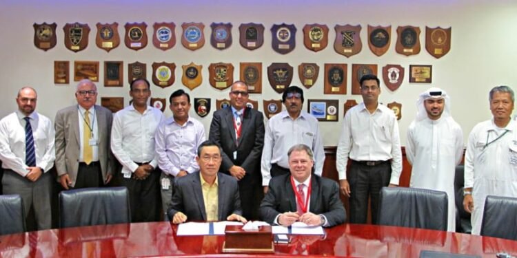 Terry McGowan, President and CEO, Thordon Bearings (seated right), and Mohammad Rizal (left), Chief Operating Officer of Drydocks World-Dubai, sign an agreement that affirms the two companies’ efforts to convert ships to seawater lubricated propeller shaft lines from oil