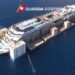 Costa Concordia wreckage under tow for ditching image description