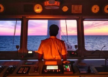 Anglo-Easter Univan Group Seafarer Standing At Bridge