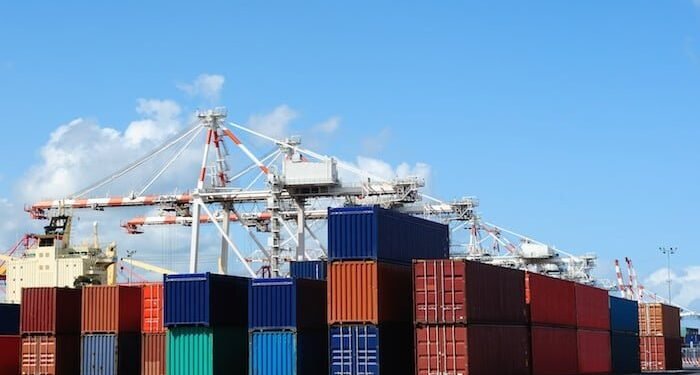 Port cranes and stacks of shipping containers