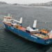 drifting heavy-lift vessel brough to port