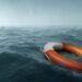 Lifebuoy floating in the vast expanse of sea