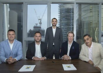 Mycrane founder Andrei Geikalo, standing, is pictured with new franchise partners following the signing of partnership agreements in Dubai