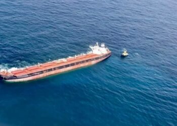Divers Inspecting Stellar Banner Hull for Damage