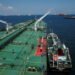 A bunker vessel prepares to supply fuel to Hin Leong's Pu Tuo Shan VLCC supertanker in the waters off Jurong Island in Singapore