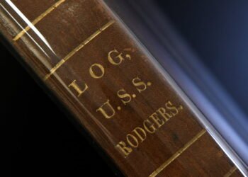 The spine of Volume 1 of the USS Rodgers logbooks is pictured at the National Archives building in Washington