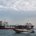 A boat of Iranian Revolutionary Guard sails next to Stena Impero, a British-flagged vessel owned by Stena Bulk, at Bandar Abbas port