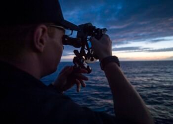 USMMA Cadet using a sextant for celestial navigation