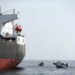 UAE Navy boats next to Al Marzoqah Saudi Arabia tanker are seen off the Port of Fujairah
