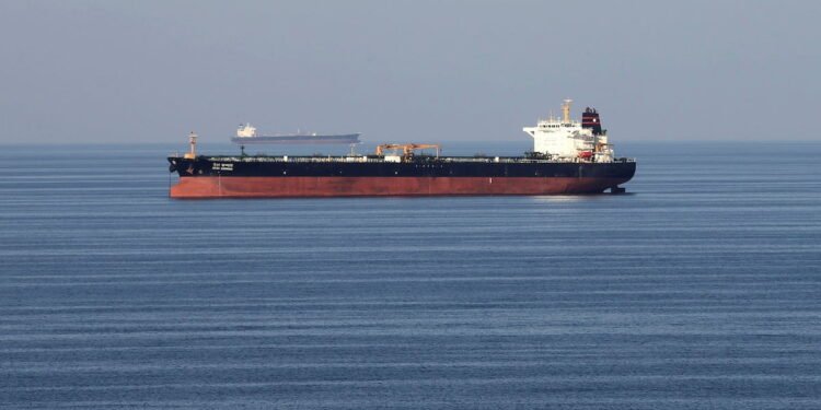 FILE PHOTO: Oil tankers pass through the Strait of Hormuz