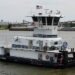 Upper River Services takes shipment of triple-screw towboat image description