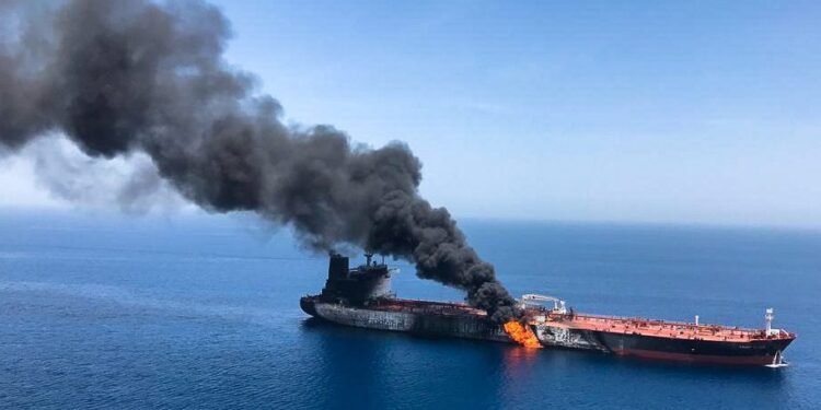 An oil tanker is seen after it was attacked at the Gulf of Oman