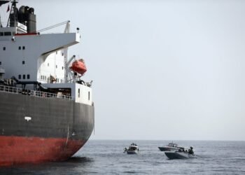 UAE Navy boats next to Al Marzoqah Saudi Arabia tanker are seen off the Port of Fujairah