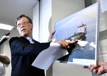 Yutaka Katada, president of shipping company Kokuka Sangyo Ltd. points to a picture of their tanker Kokuka Courageous, one of two that were hit in suspected attacks in the Gulf of Oman, during a news conference in Tokyo