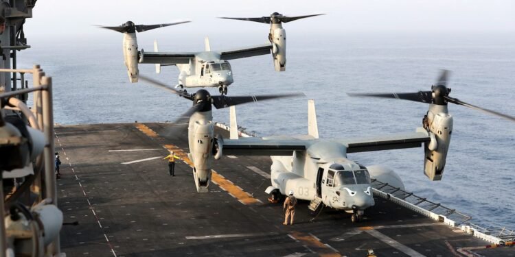 An MV-22 Osprey aircraft lands on the deck of the USS Boxer (LHD-4) in the Arabian Sea off Oman