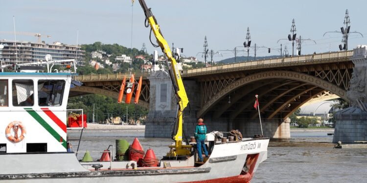 A search operation continues near the Margaret bridge on the Danube river after a boat carrying South Korean tourists capsized in Budapest