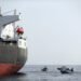 UAE Navy boats next to Al Marzoqah Saudi Arabia tanker are seen off the Port of Fujairah