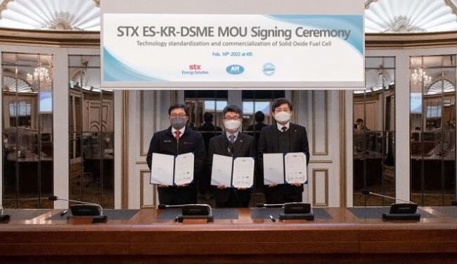 Image shows the three representatives at the MOU signing. Larger image available on request,