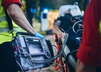Team Of Emergency Medical Service Rescuing Old Patient Selective Focus