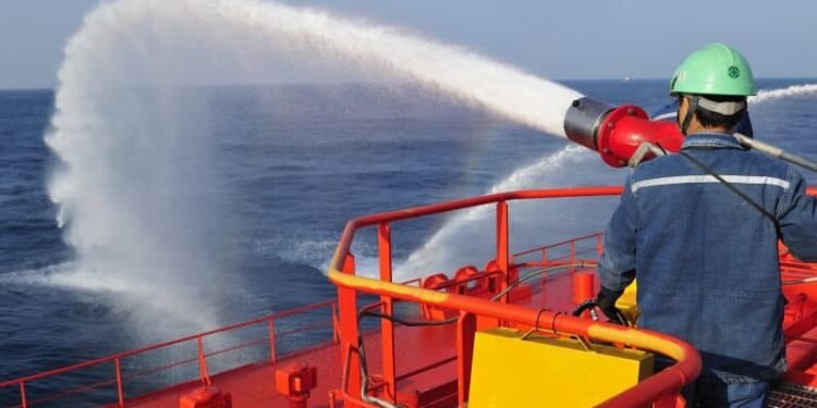 Fireman testing a foam/water gun
