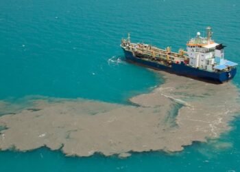 ship discharging effluent at sea