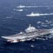 FILE PHOTO: China's Liaoning aircraft carrier with accompanying fleet conducts a drill in an area of South China Sea
