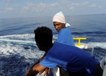Migrants are seen resting on board the MV Aquarius rescue ship