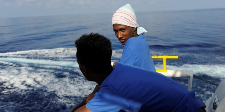 Migrants are seen resting on board the MV Aquarius rescue ship