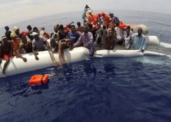 FILE PHOTO: Migrants on a dinghy are rescued by "Save the Children" NGO crew from the ship Vos Hestia in the Mediterranean sea off Libya coast