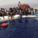 FILE PHOTO: Migrants on a dinghy are rescued by "Save the Children" NGO crew from the ship Vos Hestia in the Mediterranean sea off Libya coast