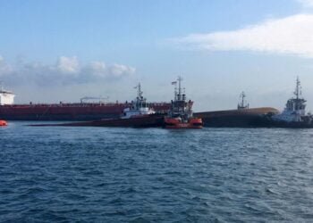singapore tanker collides with dredger