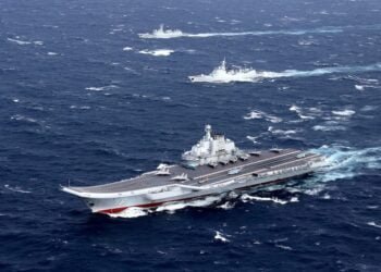 FILE PHOTO: China's Liaoning aircraft carrier with accompanying fleet conducts a drill in an area of South China Sea