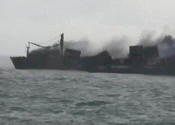 Smoke billows from wreck