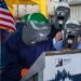 Welder at USS Pittsburgh (LPD 31) keel laying ceremony