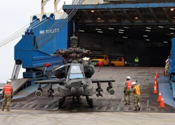 Helicopter being loaded onto American Roll-On Roll-Off Carrier