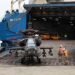 Helicopter being loaded onto American Roll-On Roll-Off Carrier