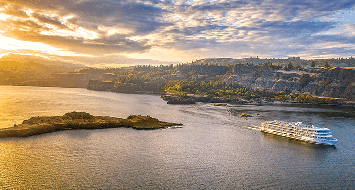 American Song river cruise ship travels down the Snake River.