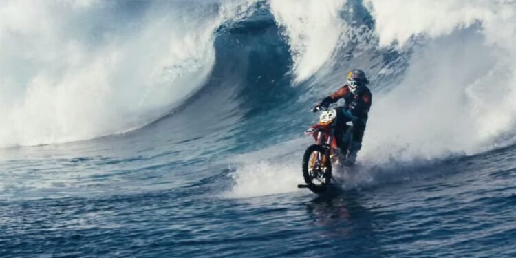 Amazing Video: Guy ‘Surfs’ Wave on Dirt Bike Amazing Video: Guy ‘Surfs’ Wave on Dirt Bike