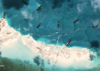 Satellite image of dredgers depositing sand on the northern rim of the Mischief Reef