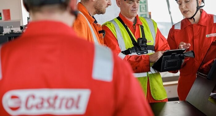 Castrol people in Castrol hats