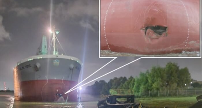 Hole in bulker bow after strike on office barge